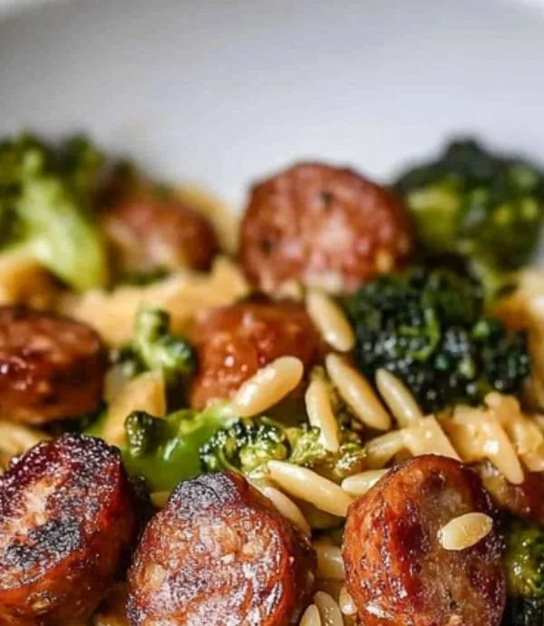 Plate of Chicken Sausage and Broccoli Orzo with fresh herbs