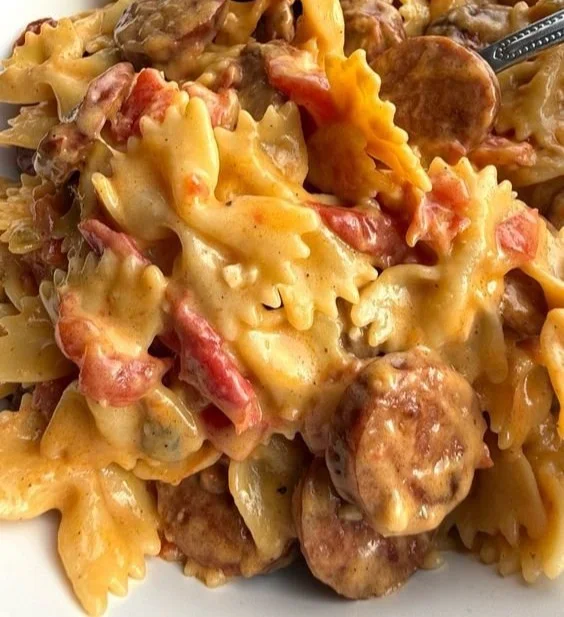 Delicious creamy pasta dish garnished with herbs and cheese
