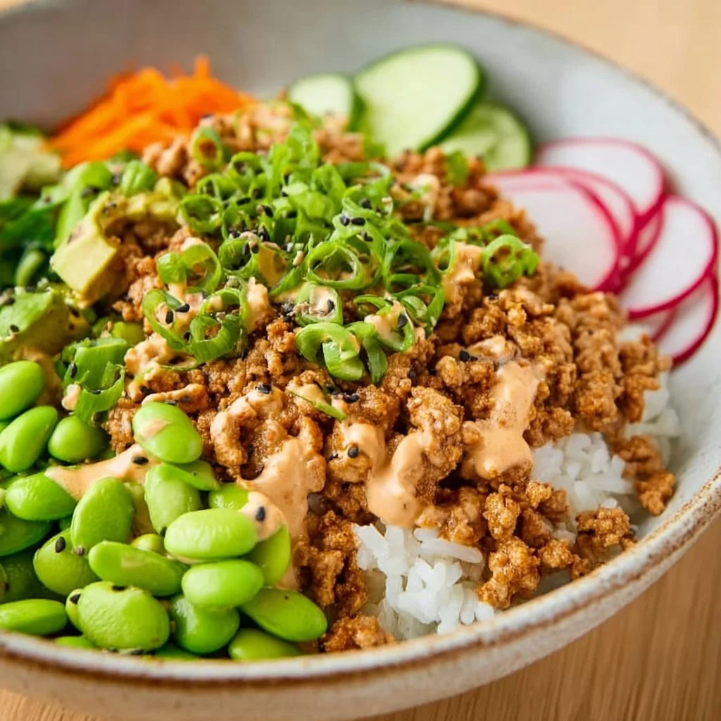 Delicious ground turkey rice bowls topped with bang bang sauce