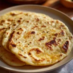 Delicious homemade gluten free flatbread on a wooden surface