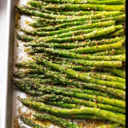 Delicious oven roasted asparagus served on a plate