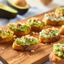 Mini avocado toasts topped with fresh ingredients for a tasty appetizer